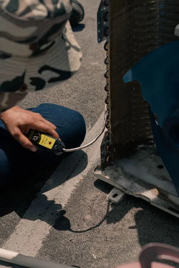 Close-up of air conditioning service work