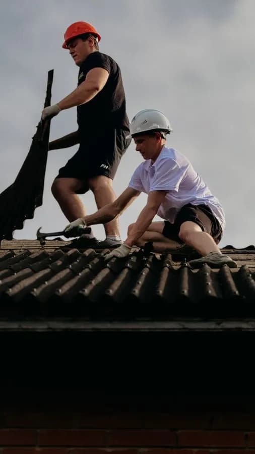 Roofing crew working on a residential roof